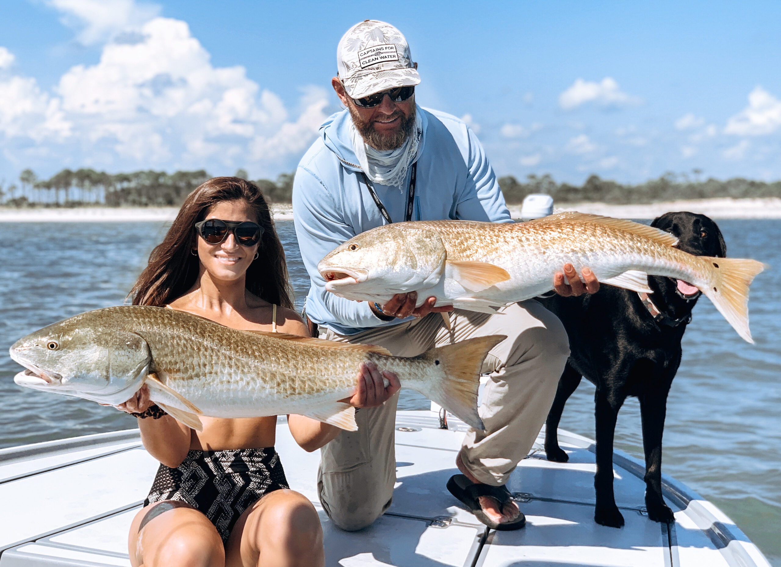 Pathfinder bay boat with anglers with redfish